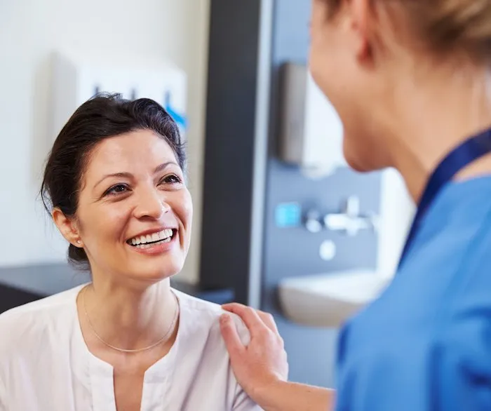 mature woman meeting with her female doctor