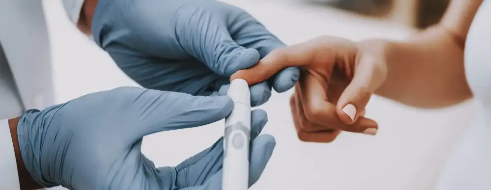 Woman getting her finger pricked