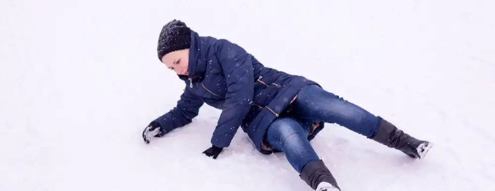 Woman that has fallen in the snow