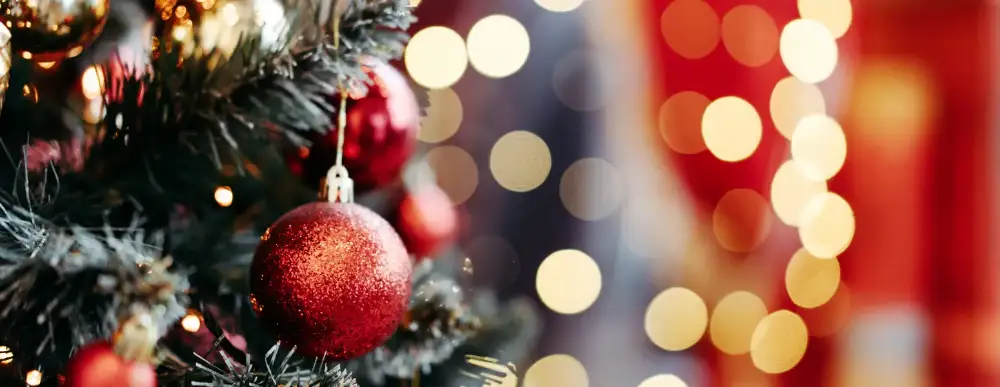 A Christmas picture close-up of a tree and ornament