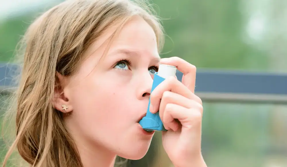 Picture of a young girl using an inhaler