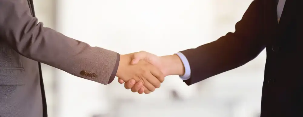 Picture of two people shaking hands