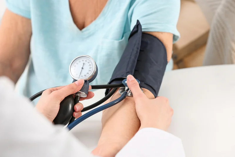 Person getting their blood pressure checked