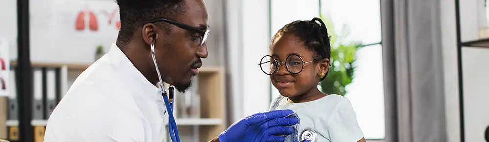 Dr. checking a child with a stethoscope