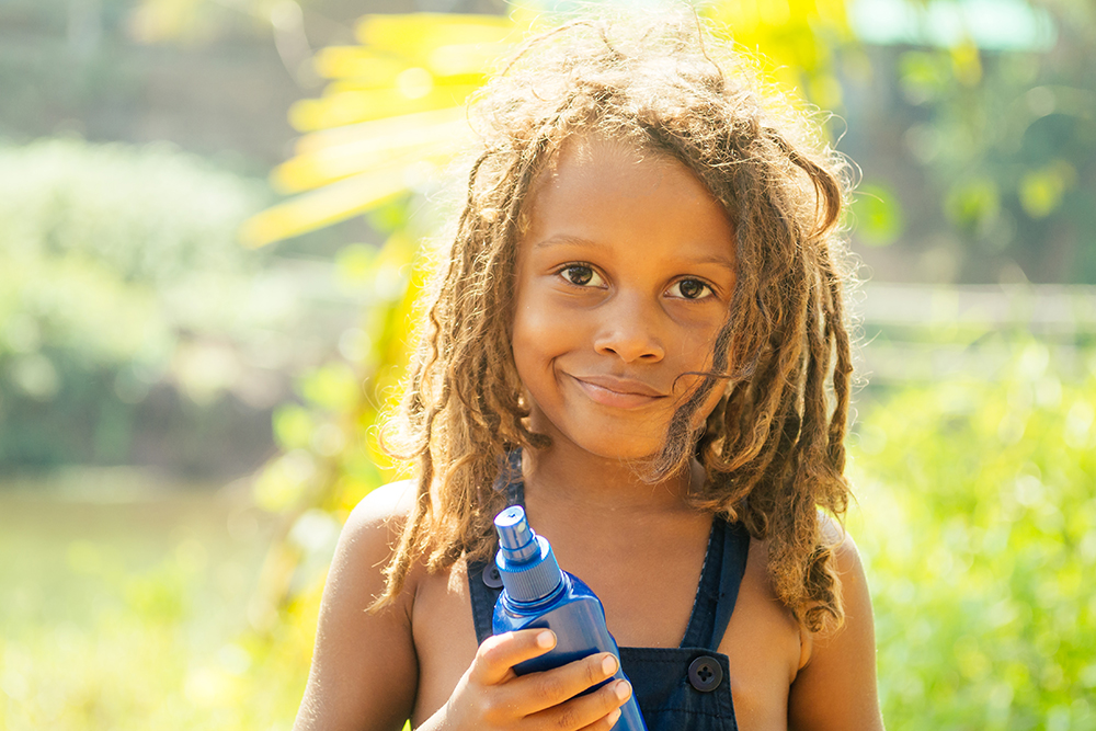 Child smiling in the sun