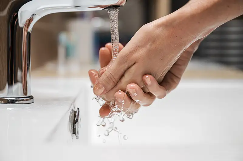 A woman washing her hands